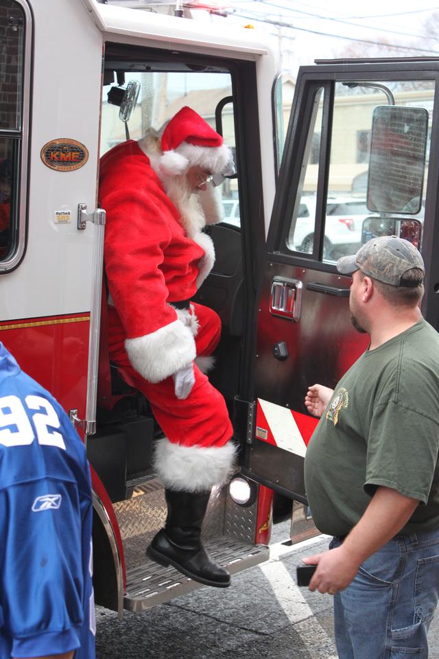 Children's Christmas Party at 8-100. 12-9-2012. Santa pays a visit . Photo by Vincent P. Tuzzolino